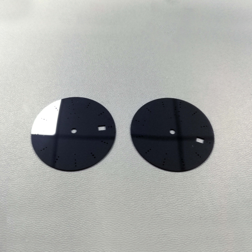 Laser processing of black zirconia watch plate — view 1 Laser processing of black zirconia watch plate — reference component view 1